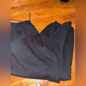 Pink sweats with rhinestone skull hands